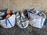 three bags that are sitting on the ground next to each other