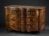 an antique chest of drawers with brass handles