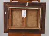 an old wooden easel with a piece of paper on top of it