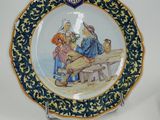 a plate with a picture of a man and a woman on it