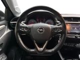 the interior of a car with a steering wheel and dashboard controls
