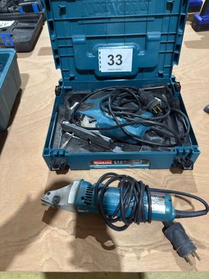 a blue box with tools on a table next to a blue box