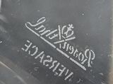 a close up of a piece of glass with a crown on it