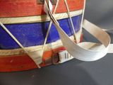 a close up of a drum with a ribbon on it