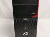 a black desktop computer sitting on top of a white surface