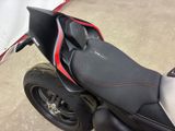 a black and red motorcycle parked in a parking lot