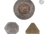 three pieces of silver and gold metal with a picture of a man on a horse