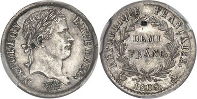 a silver coin with an image of a woman on it