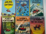 several children ' s books are lined up on a white surface