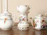 three different types of teapots sitting on a table