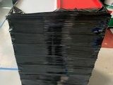 a stack of black and red boxes on a pallet in a warehouse