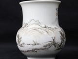 a white vase with a painting on it on a black background