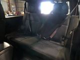a picture of the back seat of a car with the sun shining through the window