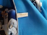 a close up of a blue shirt with a tie on it
