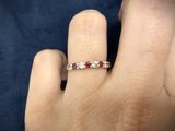 a close up of a person ' s hand with a ring on it