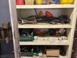 a tall white cabinet with lots of tools on it