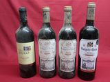 four bottles of wine are lined up on a red background