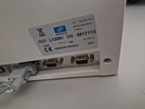 a close up of a white box with a cable connected to it