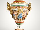 a vase that has a painting on it on the top of it
