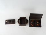 a small wooden box with a ring inside of it