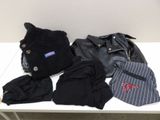 a pile of clothes and a hat on a table