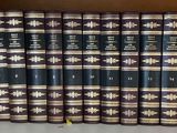 many books that are on a shelf in a book case