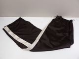 black and white pants with white stripes on them on a white surface