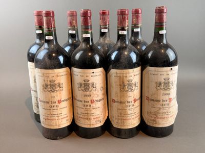 six bottles of wine are lined up in a row on a table