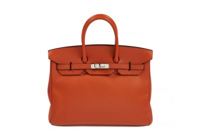 the hermes bag in orange leather with silver hardware