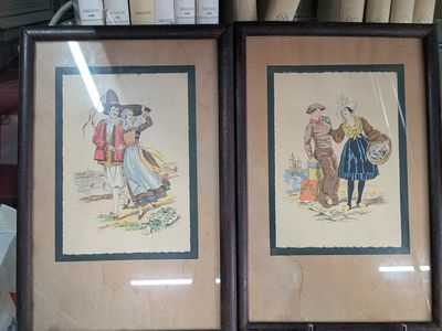 two framed pictures of a man and a woman on a shelf