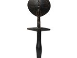 an image of a wooden object on a stand with a white background