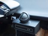 a close up of a car dashboard with a remote control