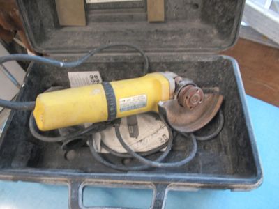 a yellow fire extinguisher sitting in a black case