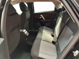 the back seats of a car with a bottle in the passenger seat