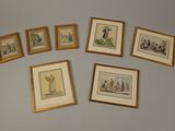 several framed pictures of people and animals on a wall