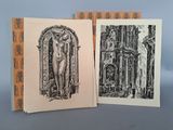 deux livres contenant des dessins de nus devant un immeuble