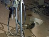 an image of a man working on a bike in a garage