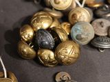 many different types of buttons and buttons on a table