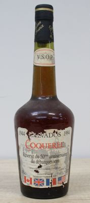 bottles of liquor are sitting on a wooden table with a white wall in the background