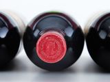 three bottles of wine sitting next to each other on a table