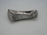 an image of a silver metal object on a white surface