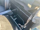 a picture of the inside of a car with the seat belt down