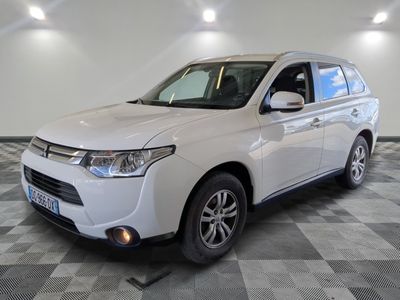 a picture of a white suv parked in a garage