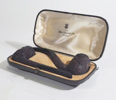 a pipe in a case that is sitting on a table