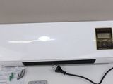an image of a white air conditioner sitting on top of a table