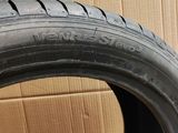 a close up of a tire on a cardboard box with a cardboard box in the background