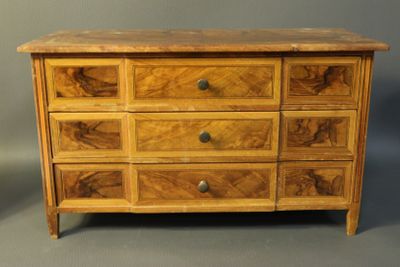 a wooden chest of drawers with drawers and drawers on each side