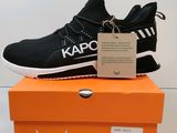 the black and white sneakers are on top of an orange box