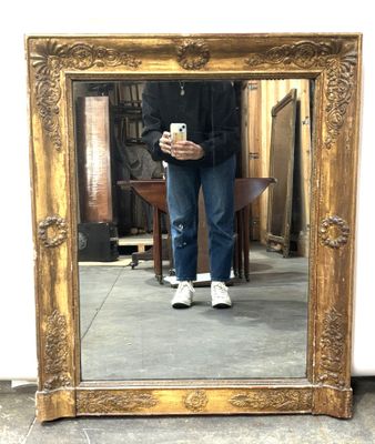 a man taking a picture of himself in a mirror
