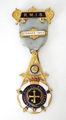 a close up of a medal with a cross on it